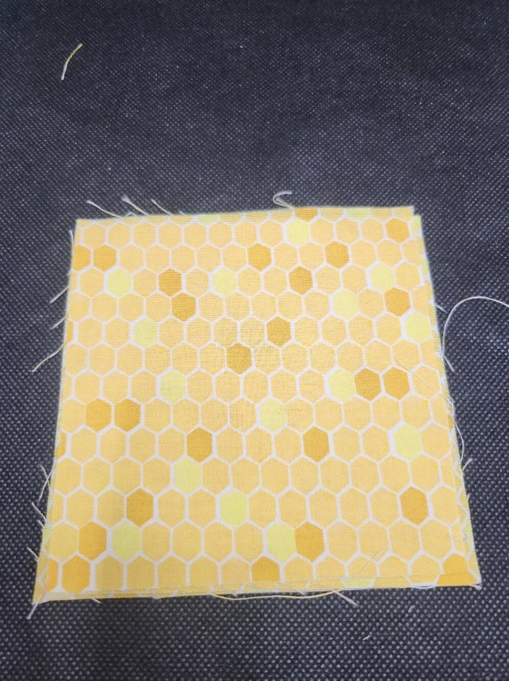 Three 4.50 inch precut cotton fabric squares